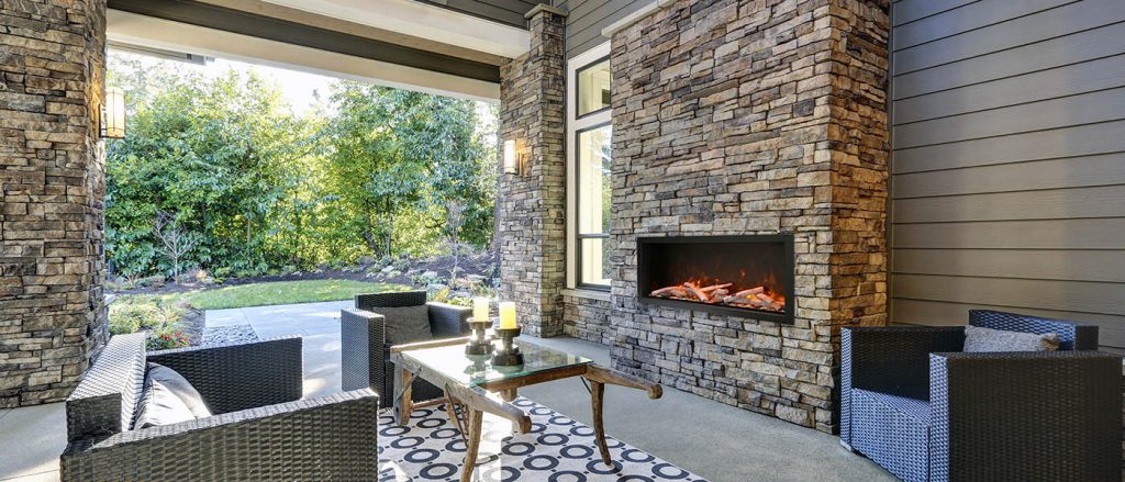 Remii WM Slim electric fireplace installed in an approved outdoor setting
