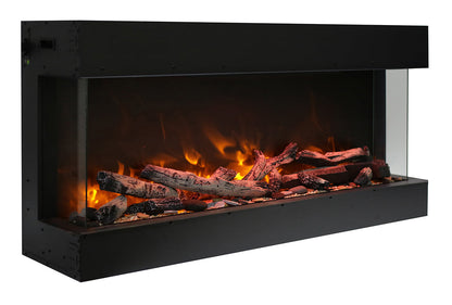 Angled view of a Remii Bay Slim Lumina three-sided electric fireplace with driftwood media