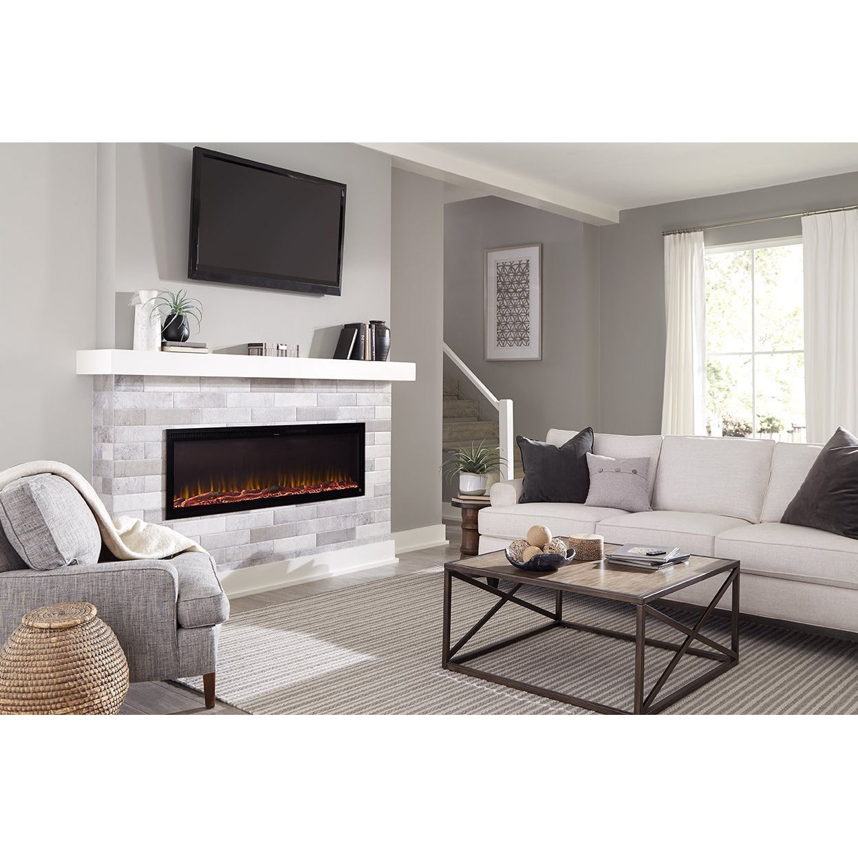 Cozy living room with Sideline Elite 72" Recessed Electric Fireplace with green flame– Very Good Fireplaces.